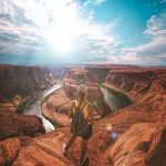 Woman standing on top of canyon